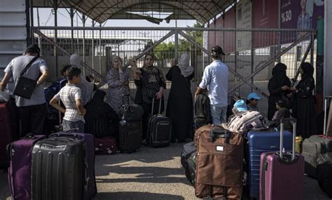 Gaza border opened to allow some badly wounded, and foreign passport holders, flee the war